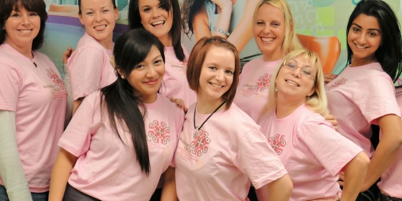 Medium warriors in pink event at the cdi college calgary south campus cheerful ladies posing for the camera